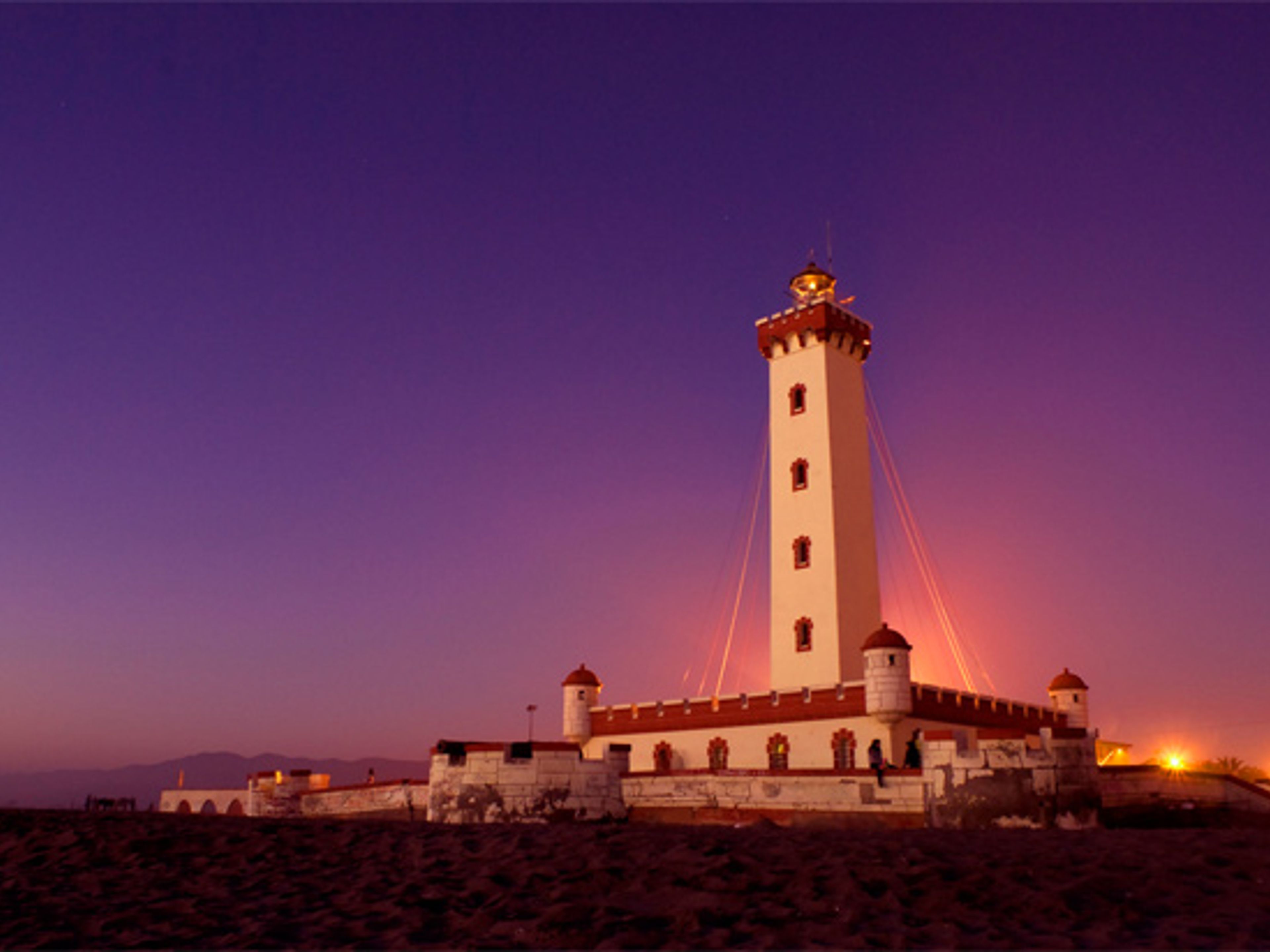 "LA SERENA & COQUIMBO BY NIGHT" TOUR. Monumental lighthouse at night Coquicombo region, Chile