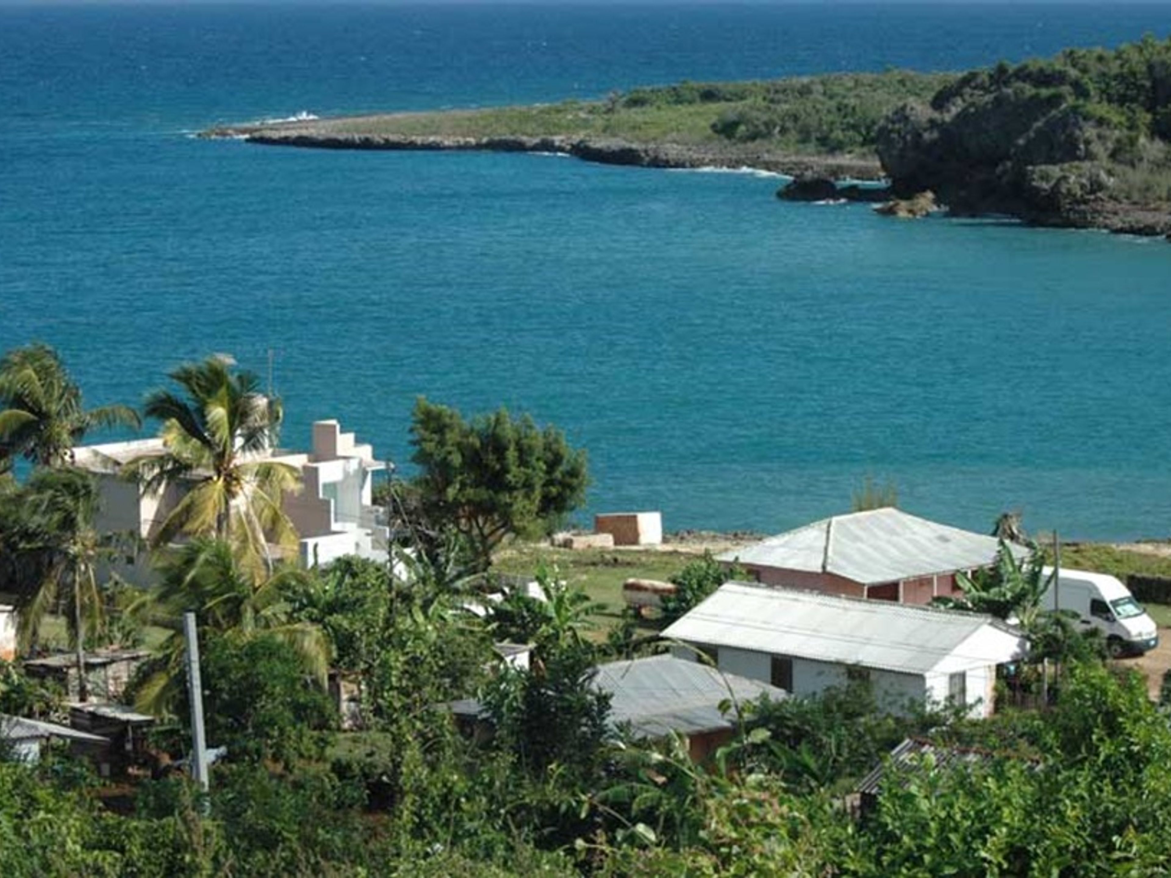 Jeep Safari “ESPERIENZA CUBANA”. Boca de Sama Fishing Village panoramic view, Holguín, Cuba.