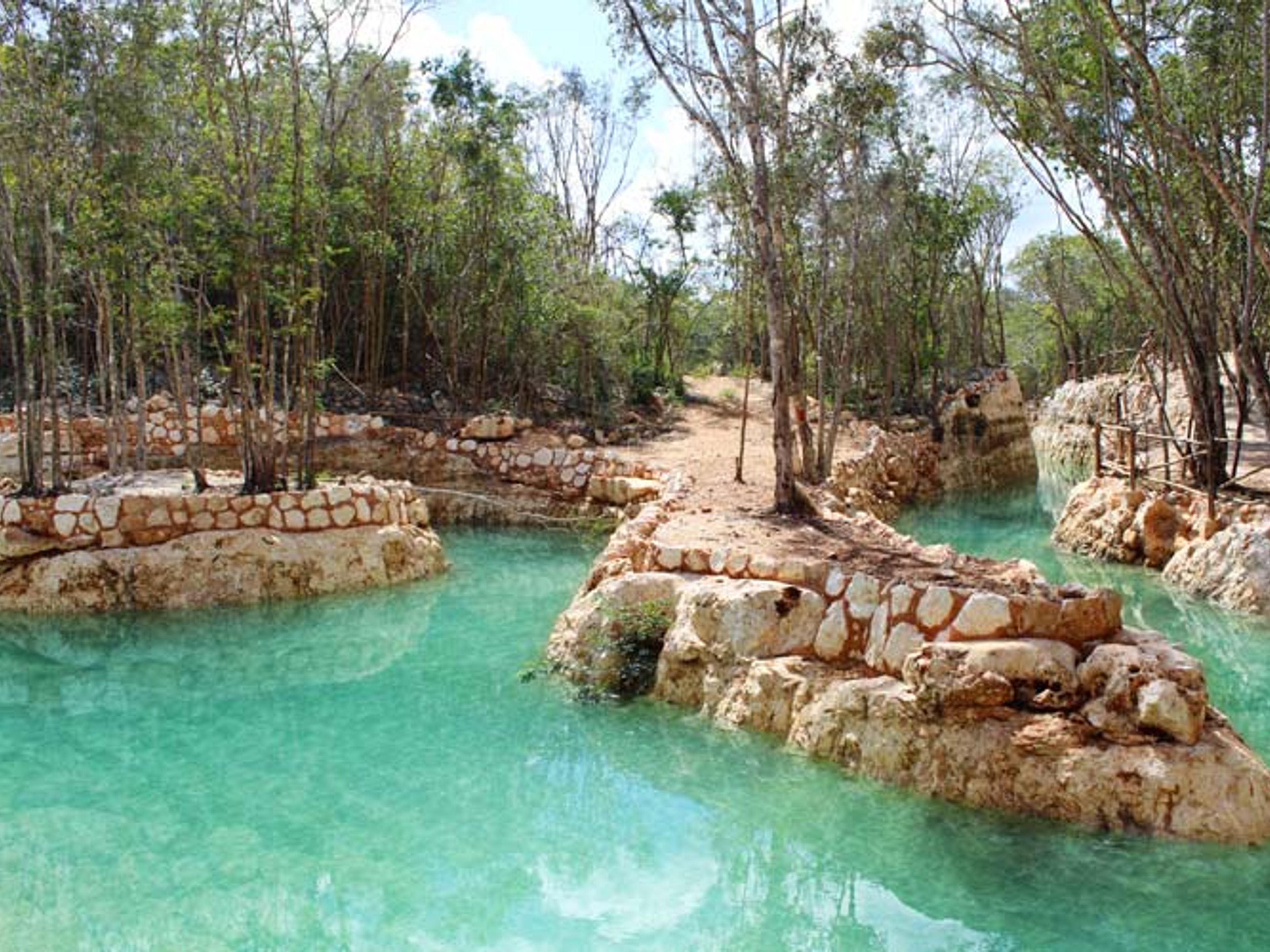 "Chichen Adventure Park Basic Entrance" Tour. Artificial baths in Chichen Adventure, have fun and be passionate about this park. Chichen Itza, Yucatan Peninsula.