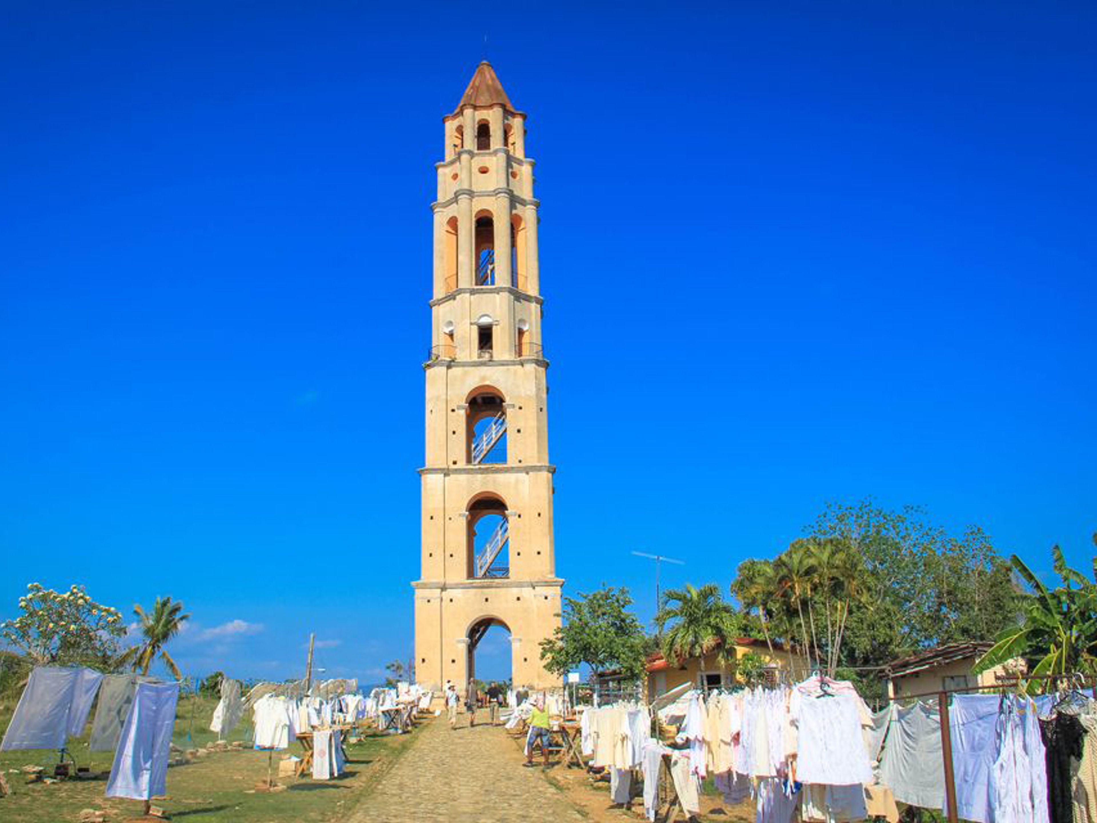 Tour “Giro a Valle dei Mulini zucchero + Sancti Spíritus en Auto d'epoca Americane”. Manaca Iznaga tower panoramic view, Valley of the Sugar Mills, “Ride to Valley of the Sugar Mills + Sancti Spíritus in Old Fashion American Classic Cars” Tour