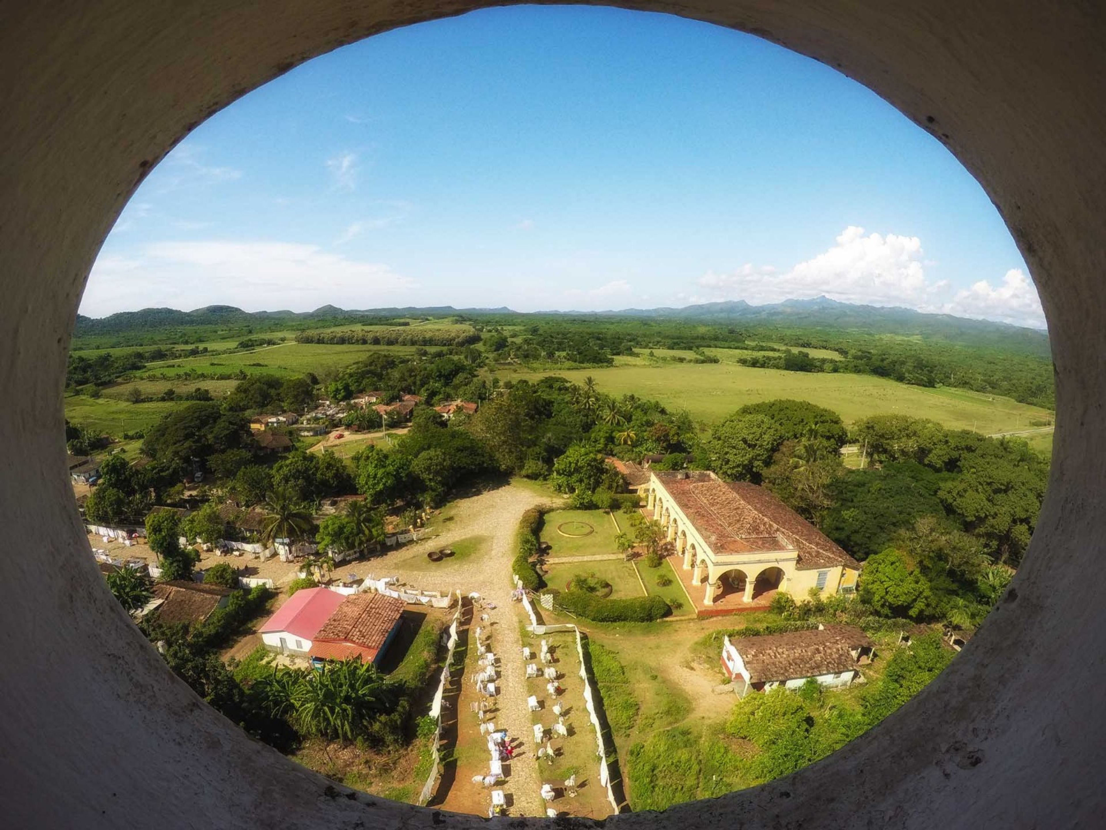“RIDE TO VALLEY OF THE SUGAR MILLS + SANCTI SPÍRITUS IN OLD FASHION AMERICAN CLASSIC CARS” Tour. Manaca Iznaga farm panoramic view, Valley of the Sugar Mills, Trinidad, Sancti Spíritus. “Ride to Valley of the Sugar Mills + Sancti Spíritus in Old Fashion American Classic Cars” Tour