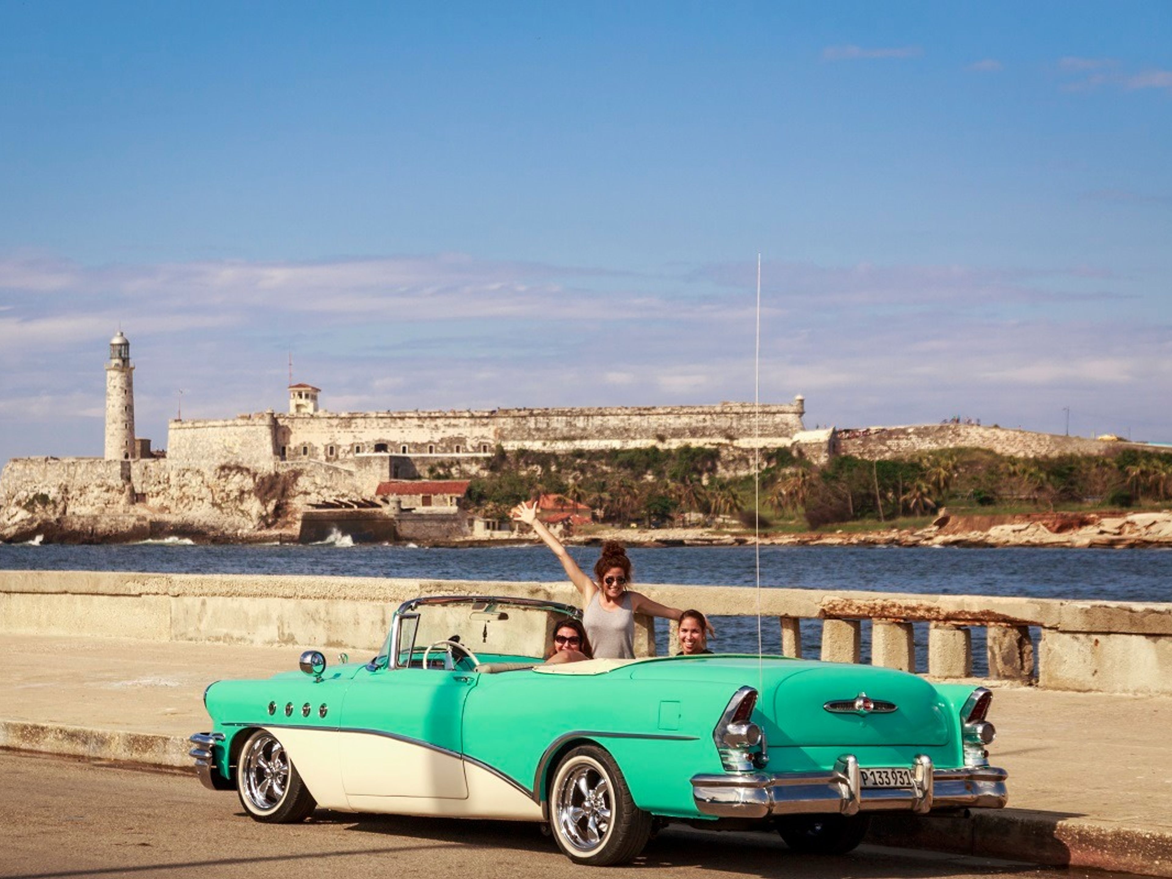 Tour “CERAMICARTE L'AVANA”. A classic car will take you along El Castillo de la Punta, the Malecón onto the 5th Avenue in Havana, Cuba.