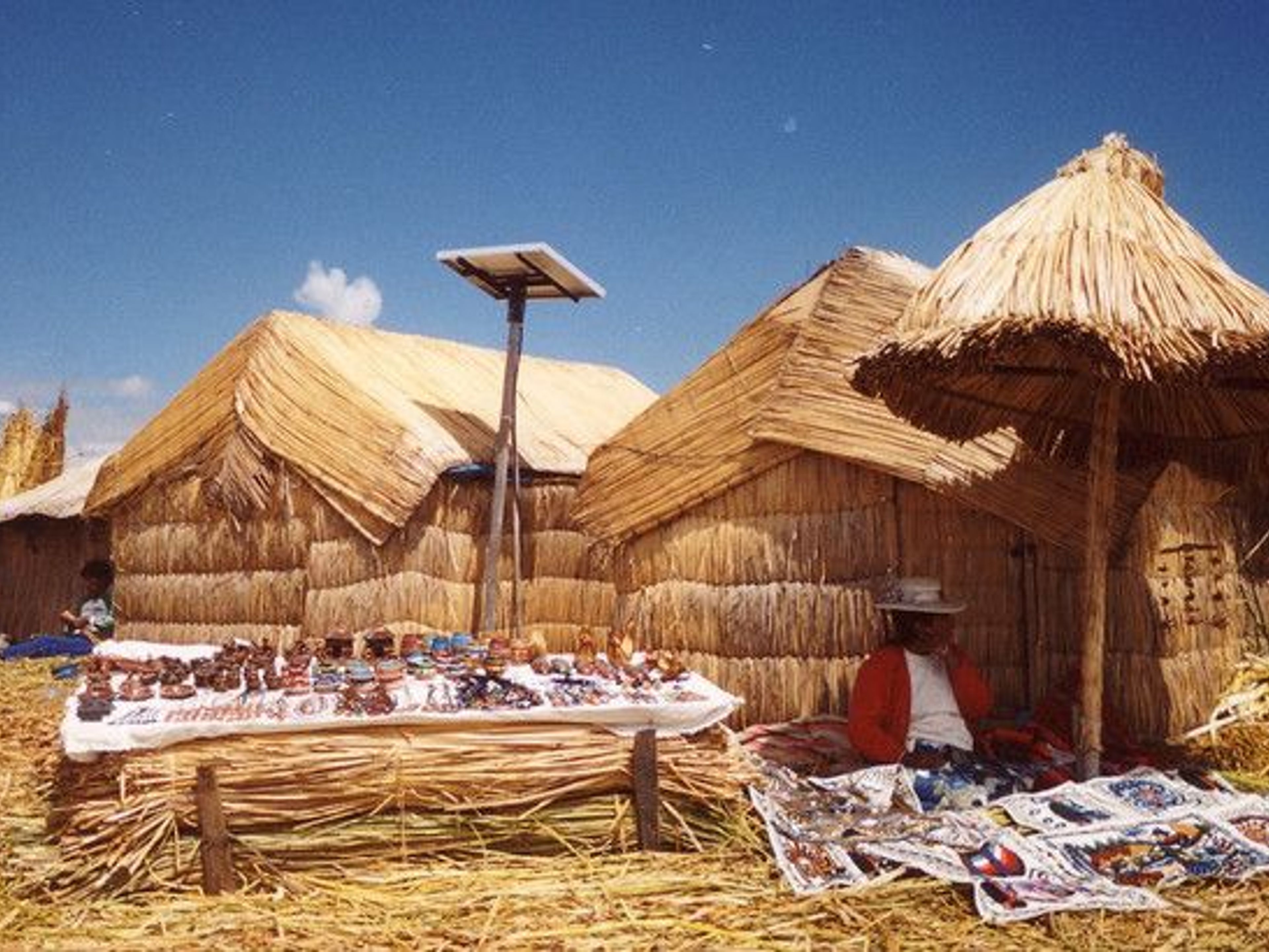 ISLAS UROS, AMANTANI AND TAQUILE OVERNIGHT TOUR. Uros Floating Islands, Peru