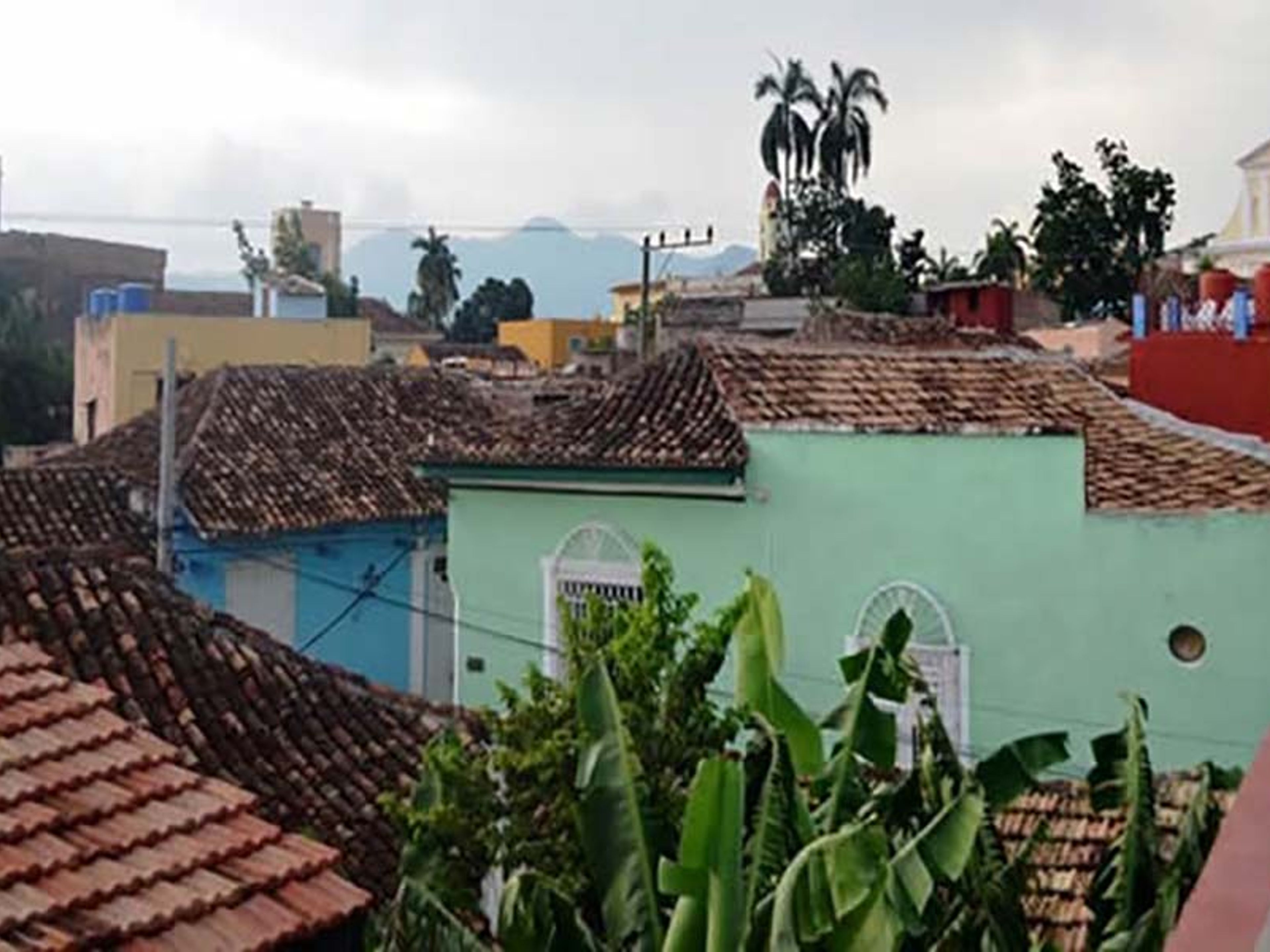Hostal Ileana Betancourt, GUSTAVO IZQUIERDO (Gloria), No.42Trinidad old city panoramic view from house's terrace