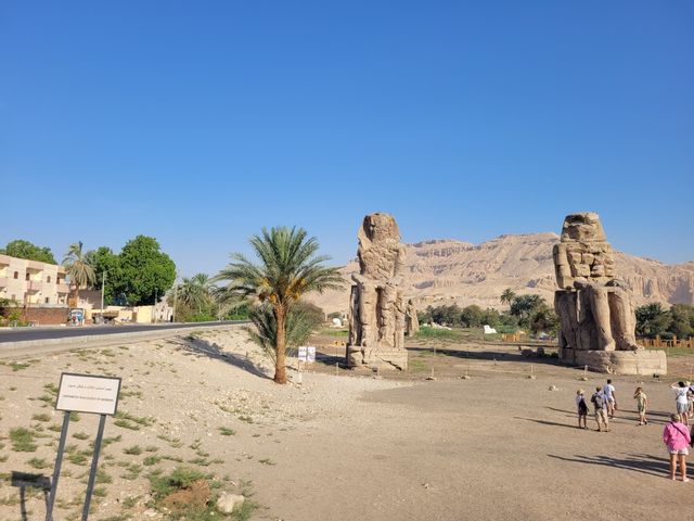 The Colossi of Memnon are two massive stone statues of the Pharaoh Amenhotep III, Luxor, Egypt.