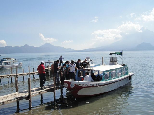 Boat ride through the waters of Atitlan lake, Guatemala