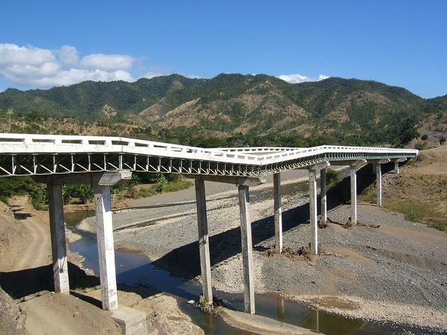 Cuba south coast road bridge from river bed and Sierra Maestra range panoramic view, Turquino National Park, Granma, Cuba.