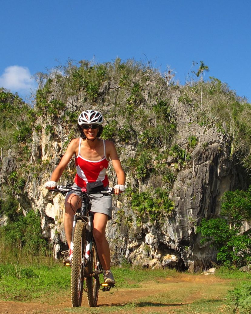 Cycling to Resvaloso River, Viñales valley National Park, declared a Cultural Heritage Site by UNESCO, Pinar del Río